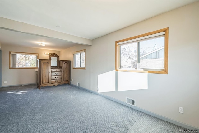 unfurnished living room with carpet