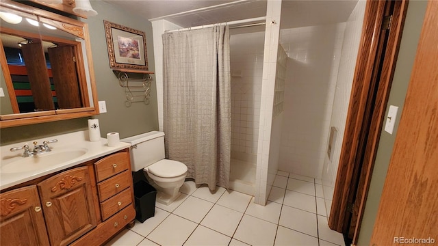 bathroom with tile patterned flooring, vanity, toilet, and a shower with curtain