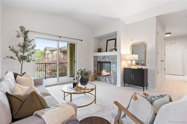 11364 Xavier Dr Unit 205, Westminster, CO 80031 - living room with a fireplace, light carpet, lofted ceiling, and visible vents