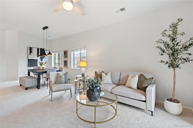 11364 Xavier Dr Unit 205, Westminster, CO 80031 - living area with light colored carpet, ceiling fan, visible vents, and baseboards