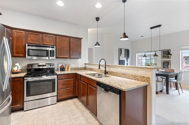 11364 Xavier Dr Unit 205, Westminster, CO 80031 - kitchen featuring light stone countertops, a sink, a peninsula, stainless steel appliances, and recessed lighting