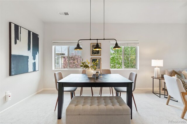 11364 Xavier Dr Unit 205, Westminster, CO 80031 - dining space featuring baseboards, light colored carpet, and visible vents
