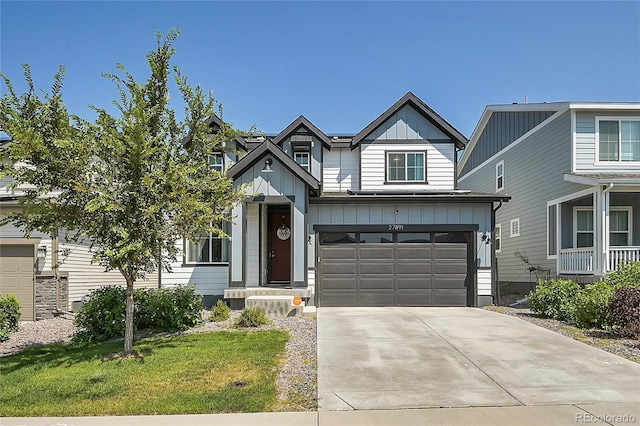 view of front of home with a front yard and a garage