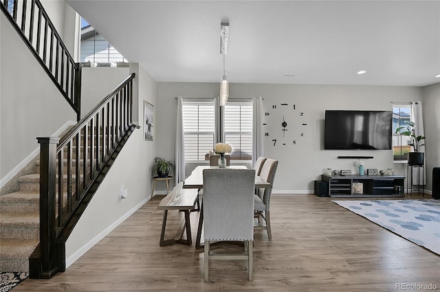 dining area with a healthy amount of sunlight and light wood-type flooring