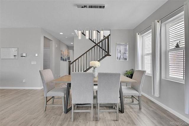 dining room featuring light hardwood / wood-style floors and a wealth of natural light