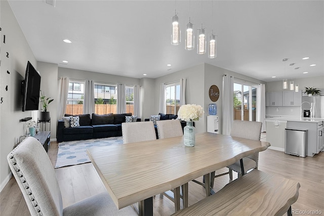 dining space featuring light hardwood / wood-style floors