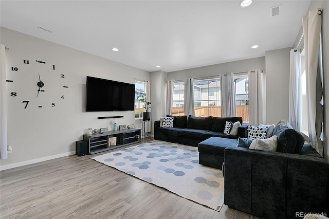 living room with light hardwood / wood-style flooring