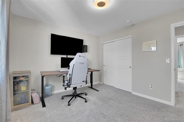 carpeted home office featuring beverage cooler