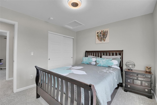 bedroom with light colored carpet and a closet