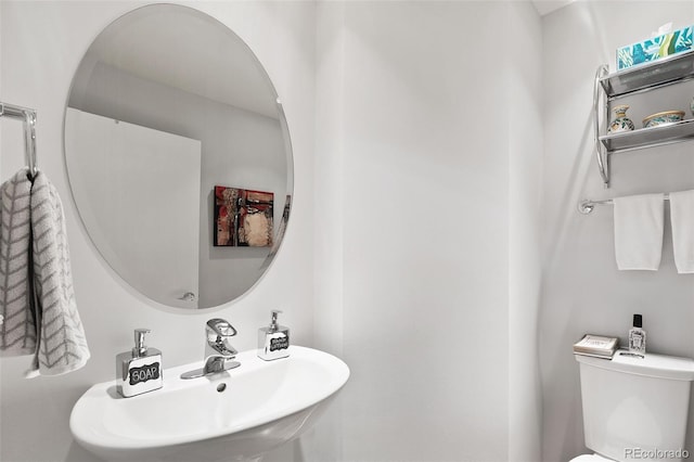 bathroom featuring a sink and toilet