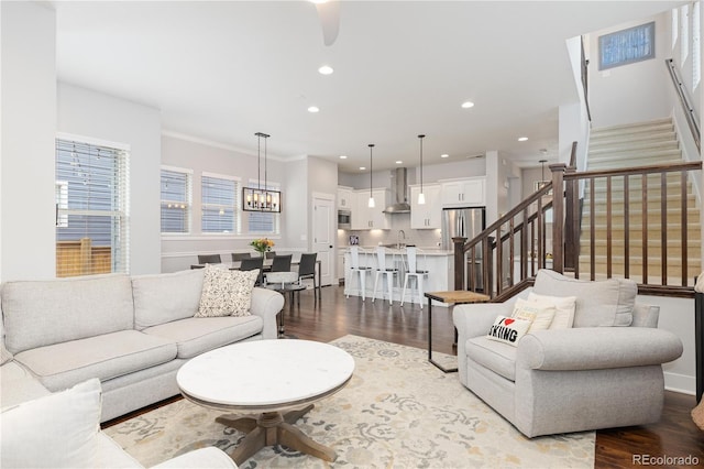 8768 E 54th Pl, Denver, CO 80238 - living room with stairs, dark wood finished floors, recessed lighting, ceiling fan, and ornamental molding