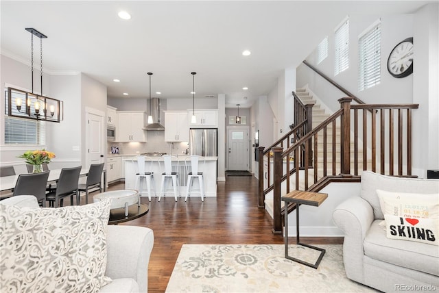 8768 E 54th Pl, Denver, CO 80238 - living area featuring stairway, dark wood-type flooring, recessed lighting, a chandelier, and baseboards