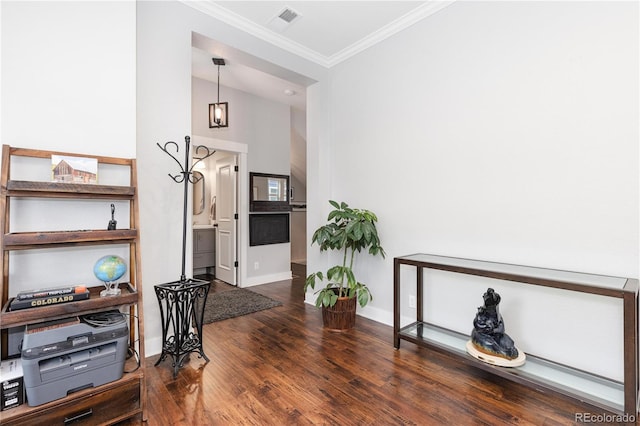 8768 E 54th Pl, Denver, CO 80238 - living area with baseboards, wood finished floors, and crown molding