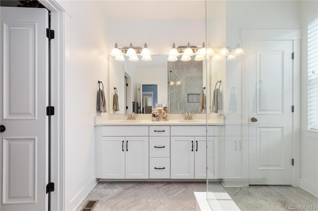 8768 E 54th Pl, Denver, CO 80238 - bathroom featuring double vanity, tiled shower, and baseboards