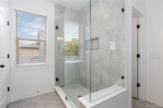 8768 E 54th Pl, Denver, CO 80238 - full bath with tiled shower and baseboards