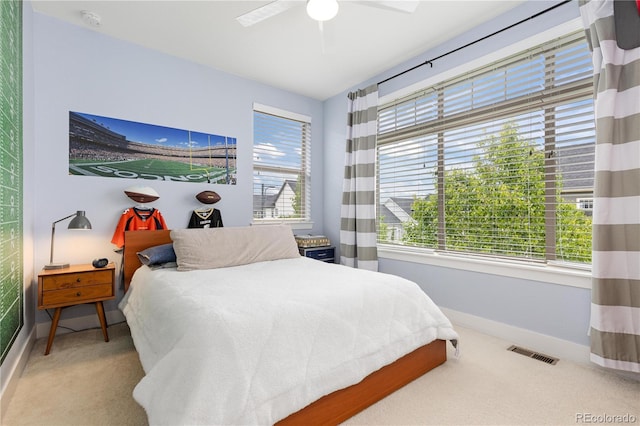 8768 E 54th Pl, Denver, CO 80238 - carpeted bedroom with baseboards and ceiling fan
