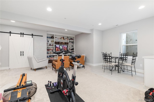 8768 E 54th Pl, Denver, CO 80238 - exercise area with recessed lighting, wood finished floors, baseboards, and a barn door