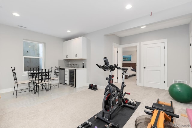 8768 E 54th Pl, Denver, CO 80238 - workout room featuring wine cooler, recessed lighting, a bar, light carpet, and baseboards