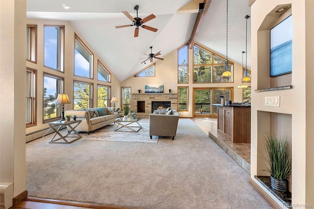 9001 Eastridge Rd, Golden, CO 80403 - carpeted living area with high vaulted ceiling, a ceiling fan, a stone fireplace, and beam ceiling