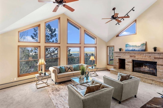 9001 Eastridge Rd, Golden, CO 80403 - carpeted living area featuring a ceiling fan, a stone fireplace, high vaulted ceiling, and a baseboard radiator