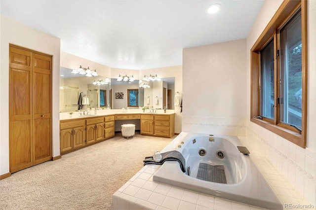 9001 Eastridge Rd, Golden, CO 80403 - bathroom featuring a tub with jets, vanity, and a shower stall
