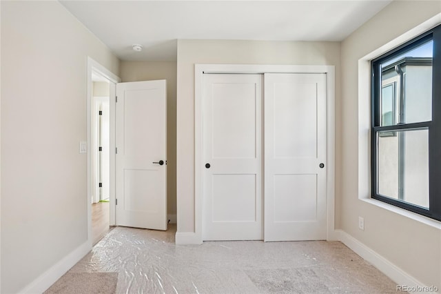 1559 N Hooker St, Denver, CO 80204 - unfurnished bedroom with a closet and carpet floors