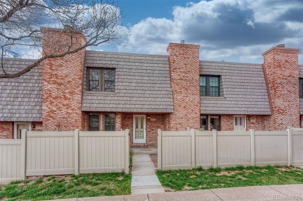 2091 Sussex Ln, Colorado Springs, CO 80909 - multi unit property with brick siding and a chimney