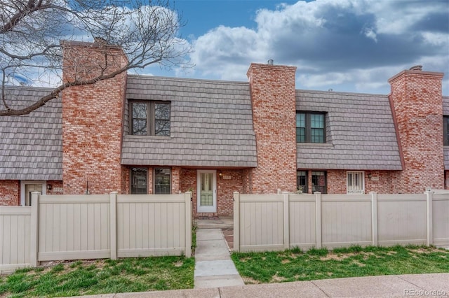 2091 Sussex Ln, Colorado Springs, CO 80909 - multi unit property with brick siding and a chimney