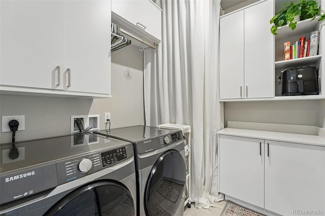 20 Wilcox St Unit 208, Castle Rock, CO 80104 - laundry room featuring separate washer and dryer and cabinet space