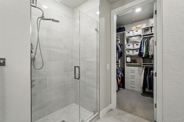 20 Wilcox St Unit 208, Castle Rock, CO 80104 - full bathroom featuring a stall shower and a spacious closet