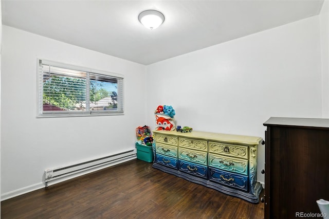 613 S Union Blvd, Colorado Springs, CO 80910 - bedroom with baseboard heating and wood finished floors