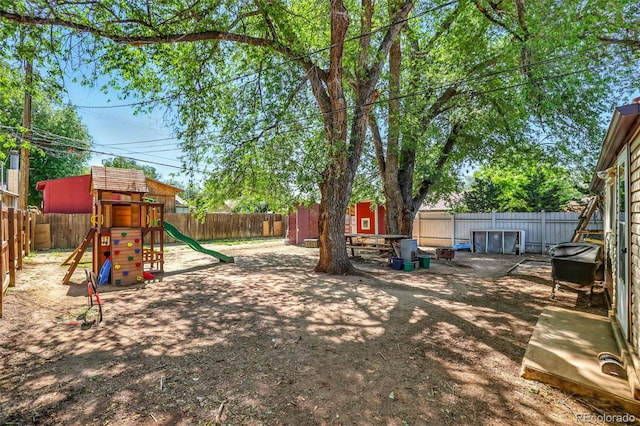 613 S Union Blvd, Colorado Springs, CO 80910 - fenced backyard with a playground