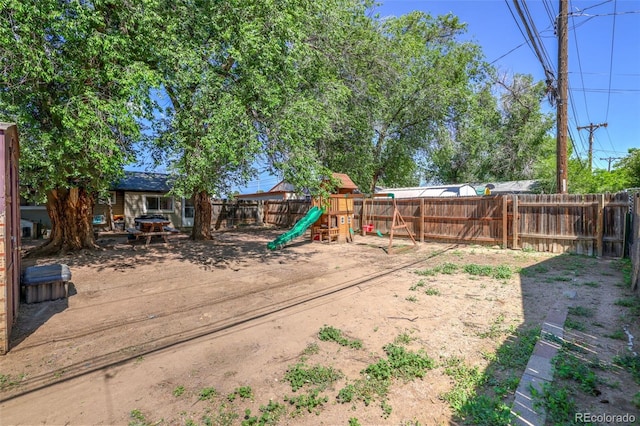 613 S Union Blvd, Colorado Springs, CO 80910 - fenced backyard featuring a playground