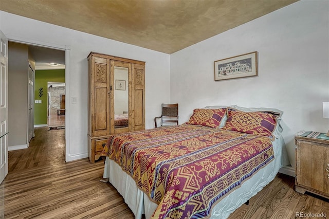 bedroom featuring hardwood / wood-style flooring