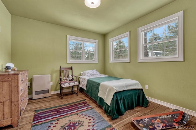 bedroom with light hardwood / wood-style floors