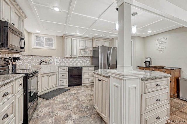 kitchen with backsplash, a kitchen island, black appliances, and decorative light fixtures