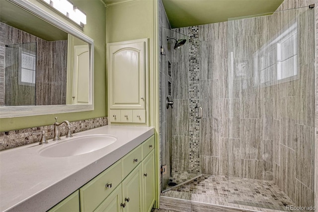 bathroom featuring vanity and an enclosed shower