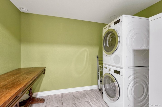 laundry area with stacked washer and clothes dryer