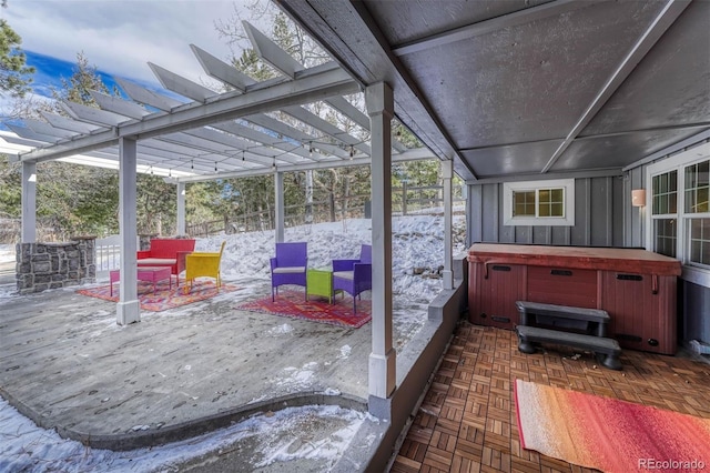 view of patio / terrace with a pergola and a hot tub