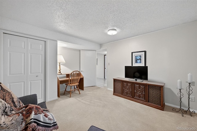 3070 W Enchanted Cir, Colorado Springs, CO 80917 - carpeted living room with a textured ceiling, baseboards, and a desk