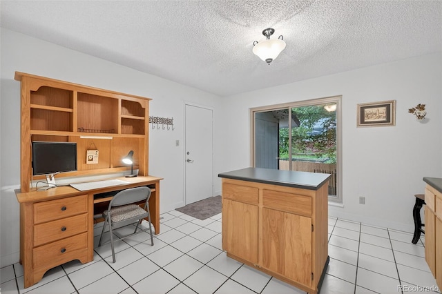3070 W Enchanted Cir, Colorado Springs, CO 80917 - office space featuring a textured ceiling, light tile patterned flooring, and baseboards