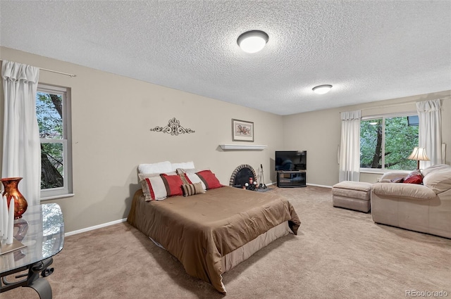 3070 W Enchanted Cir, Colorado Springs, CO 80917 - carpeted bedroom featuring a textured ceiling and baseboards
