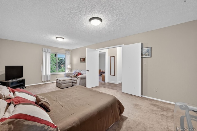 3070 W Enchanted Cir, Colorado Springs, CO 80917 - carpeted bedroom with a textured ceiling and baseboards