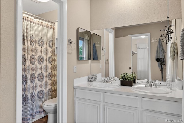 3070 W Enchanted Cir, Colorado Springs, CO 80917 - bathroom with double vanity, toilet, and a shower with curtain