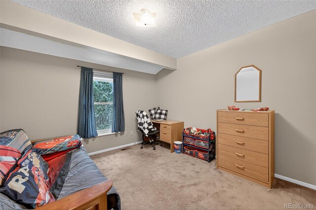 3070 W Enchanted Cir, Colorado Springs, CO 80917 - bedroom with light colored carpet, a textured ceiling, and baseboards