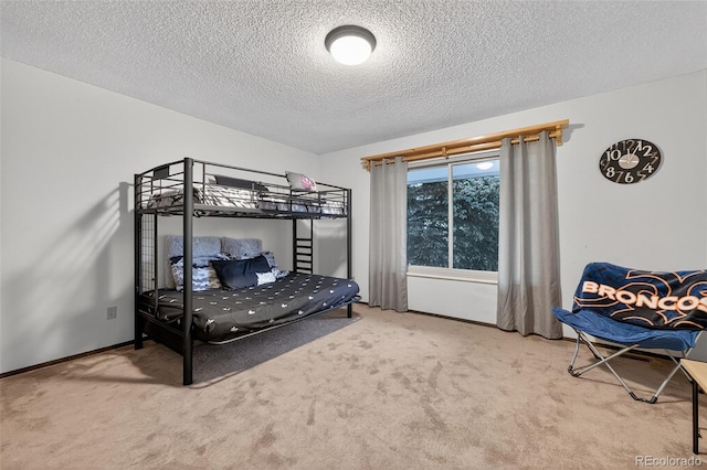 3070 W Enchanted Cir, Colorado Springs, CO 80917 - bedroom with carpet, a textured ceiling, and baseboards