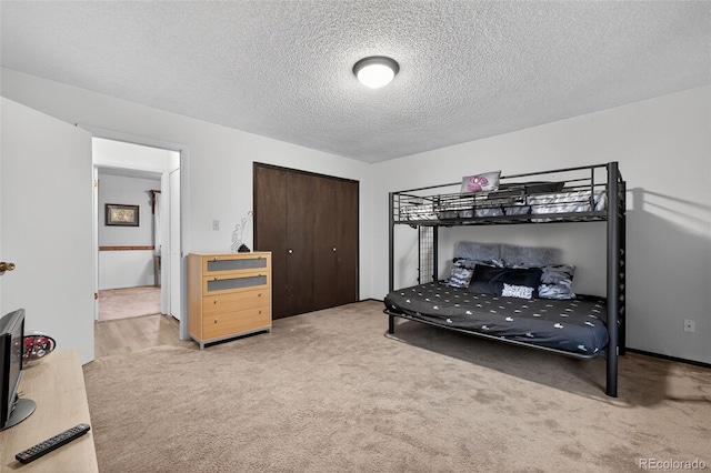 3070 W Enchanted Cir, Colorado Springs, CO 80917 - carpeted bedroom with a textured ceiling and a closet