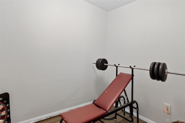 3070 W Enchanted Cir, Colorado Springs, CO 80917 - workout room featuring baseboards and a textured ceiling