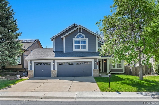 9008 W 101st Ave, Broomfield, CO 80021 - view of front facade with driveway, brick siding, roof with shingles, and a garage