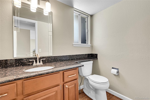 9008 W 101st Ave, Broomfield, CO 80021 - half bathroom featuring wood finished floors and vanity